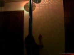 Black haired tranny dances around the pole before stroking