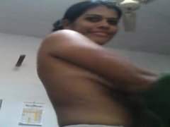 Desi aunty dress change and showing huge melons