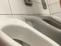Is he still shaking his cock at the urinal or playing with it
