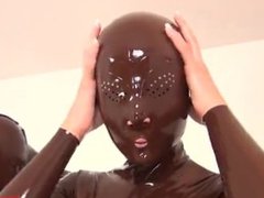 Pussy Lips Gag in Latex Suit Enclosure