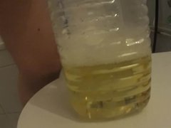 Two friends pissing in one bottle (peeing)