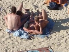 Group of guys having sex on the beach