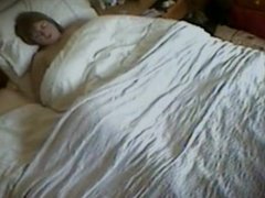 Aunt with her rabbit under the covers.