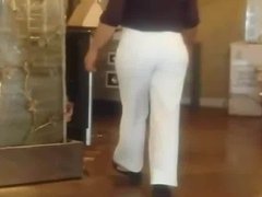 Candid big booty milf in tight white pants.