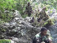 Army boys scout for hard meat outdoors