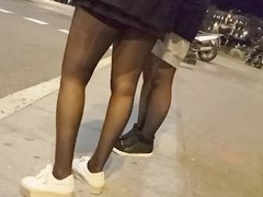 Girl in laddered black pantyhose