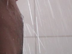 Naked in the shower with erect penis