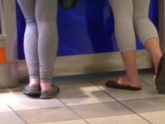 Two teens in white leggings at the mall