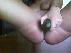 Latina fucks cucumber