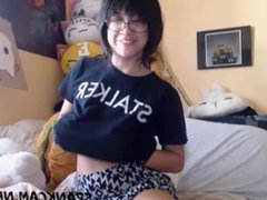 Cute asian teen playing with her manga doll