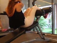 Hidden cam at the gym to spy this hot brunette teen working out in leggings