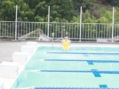 Japanese girl swim in pool with yellow swimsuit SOFT