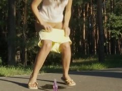 sexy teen pissing on the road in the forest