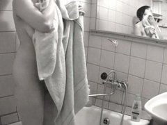 Alluring busty amateur  takes a shower to wash private