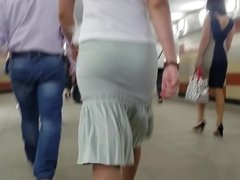 MILF's ass in tight skirt