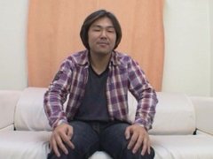 Japanese guy gets comfortable on the couch and jerks off