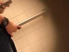 Latino guy jerking off in college bathroom