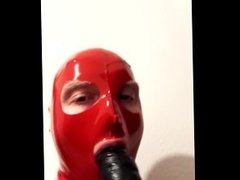 PVC-Latex Gay sucks huge rubber cock