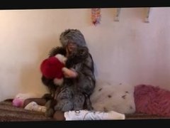 Slut in big warm fur teases cunt with toys