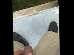 pissing off the side of the roof