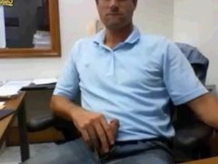 Stroking his cock in his office