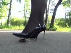 Sexy Lena crushing crawdads on street under sharp heels.