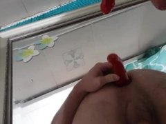 Playing with dildo in asshole