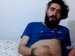 gay bearded young cub plays with his cock and nipple