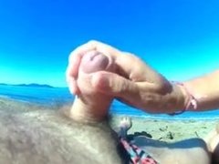 Granny masturbating stranger on the beach.