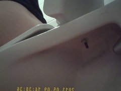 Girl taking a piss