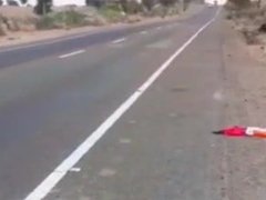 Latina girl walking nude by the road