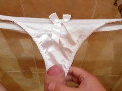 Playing with white satin thongs and cum