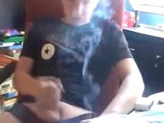 Smoking and jerking his cock