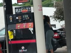 Brunette in tights at the gas station