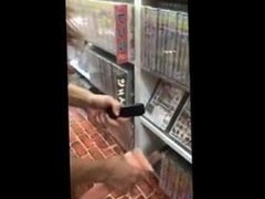 Naked Asian tries out vibrator in sex shop