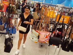 Candid voyeur latina in tiny dress shopping in raiders cap