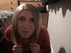 Crossdresser hiding behind bed