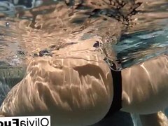 Horny Olivia Austin plays with her pussy underwater