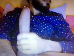 Bearded dude jerking his huge hung cock