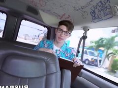 Busty babe fucks young nerds cock during a van ride