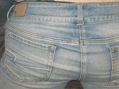 Slippery cumshot on her jeans ass