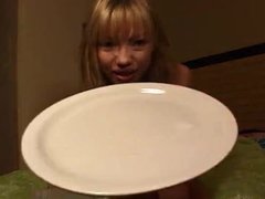 Beautiful Asian girl spits phlegm onto a plate and shows us