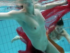 Two hotties submerged underwater