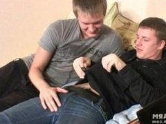 Two boys unzip their pants and go for a blowjob
