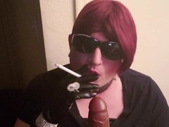 Sissy smoking and practicing sucking cock in leather gloves