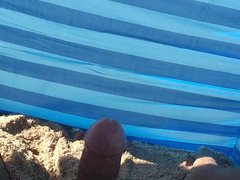 Big cock handjob on the beach