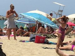 Two milfs are changing their clothes at the beach