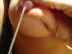 Puffy girl rubs milk on her pussy