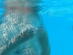 mature underwater in swimming pool