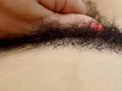 Mexican slut runs her fingers through her hairy pussy